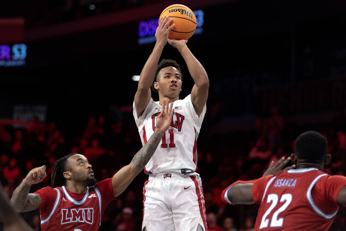 UNLV Rebels guard Dedan Thomas Jr. (11) shoots against Loyola Marymount Lions guard Justice Hil ...