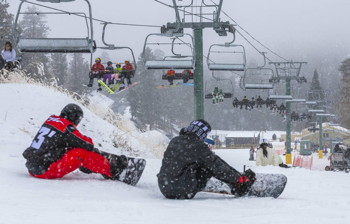 Skiers and snowboarders use the beginner lift and hill at the Lee Canyon Ski Resort as it conti ...