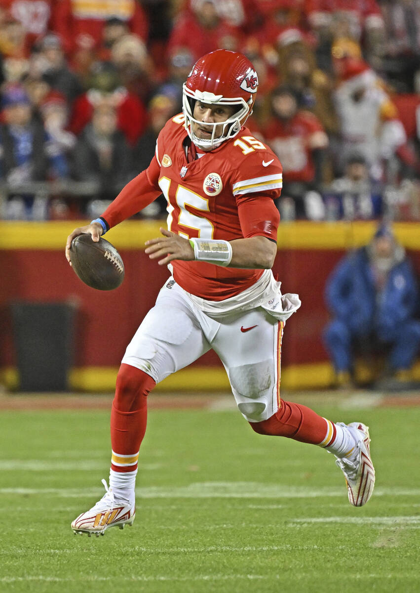 Kansas City Chiefs quarterback Patrick Mahomes (15) runs down field with the ball during an NFL ...