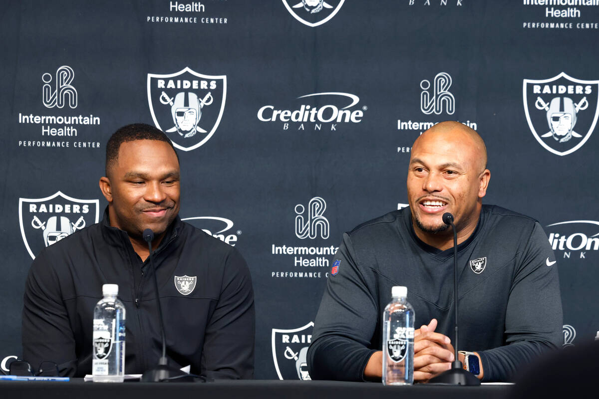 Champ Kelly, Raiders interim general manager, left, and Antonio Pierce, interim head coach, smi ...