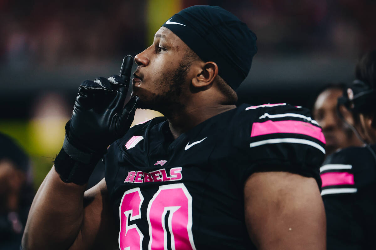UNLV offensive lineman Amani Trigg-Wright (60) puts a finger to his mouth on the sidelines duri ...
