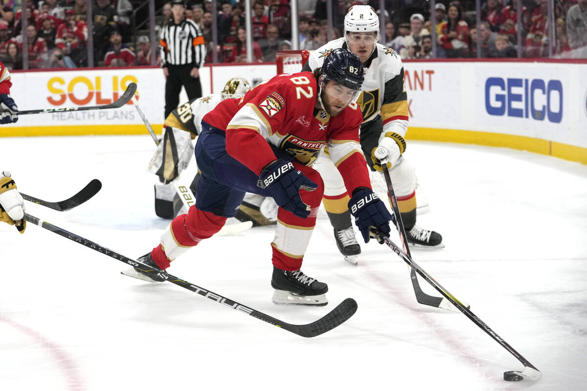 Florida Panthers center Kevin Stenlund (82) and Vegas Golden Knights defenseman Zach Whitecloud ...