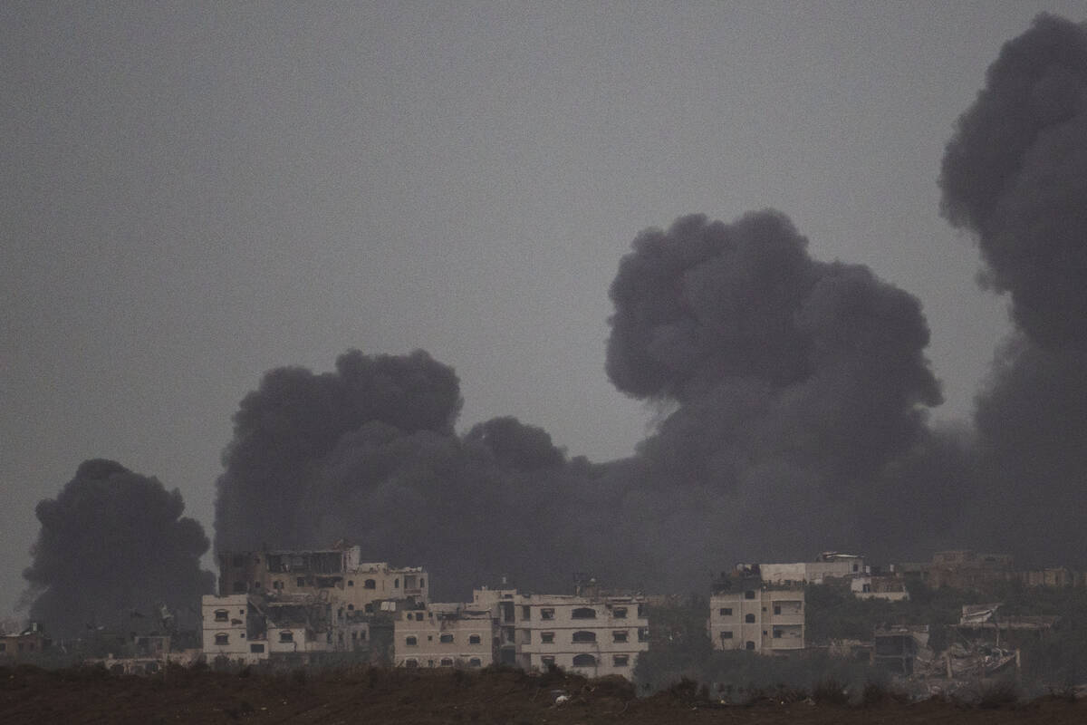 Smoke rises to the sky after an explosion in Gaza Strip as seen from Southern Israel, Saturday, ...