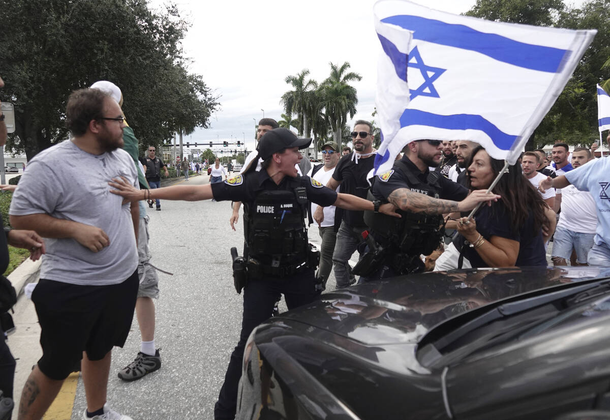 FILE - Fort Lauderdale police separate members of pro-Israel and pro-Palestinian protests, Sund ...