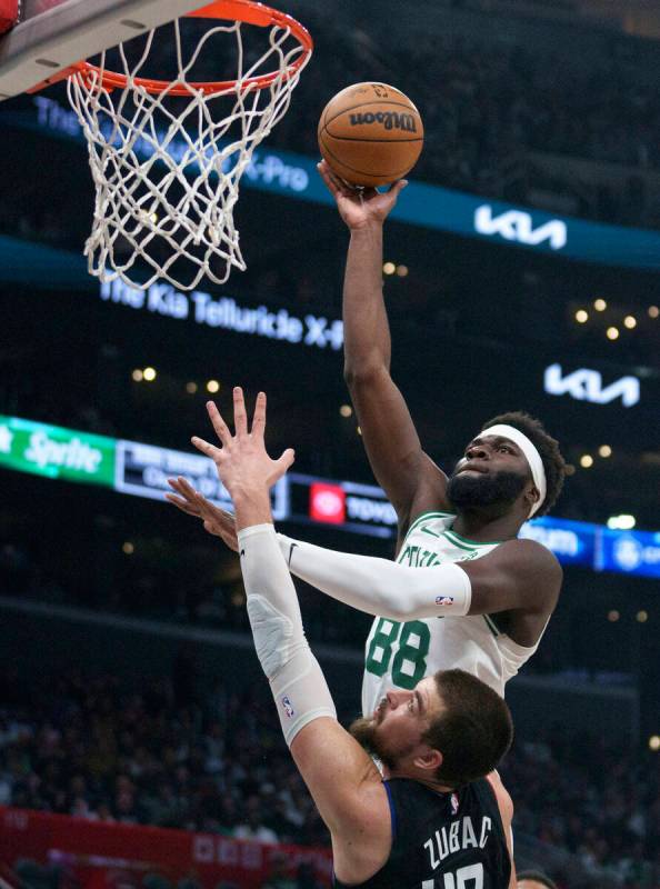 Boston Celtics center Neemias Queta (88) shoots over Los Angeles Clippers center Ivica Zubac (4 ...