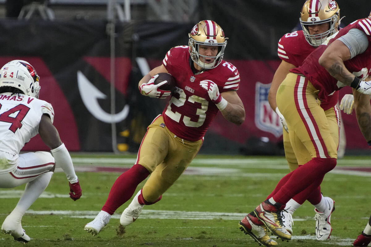 San Francisco 49ers running back Christian McCaffrey (23) throws the ball against the Arizona C ...