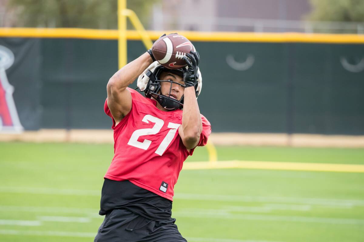 UNLV junior wide receiver Jacob De Jesus catches a pass during the Rebels' practice in preparat ...