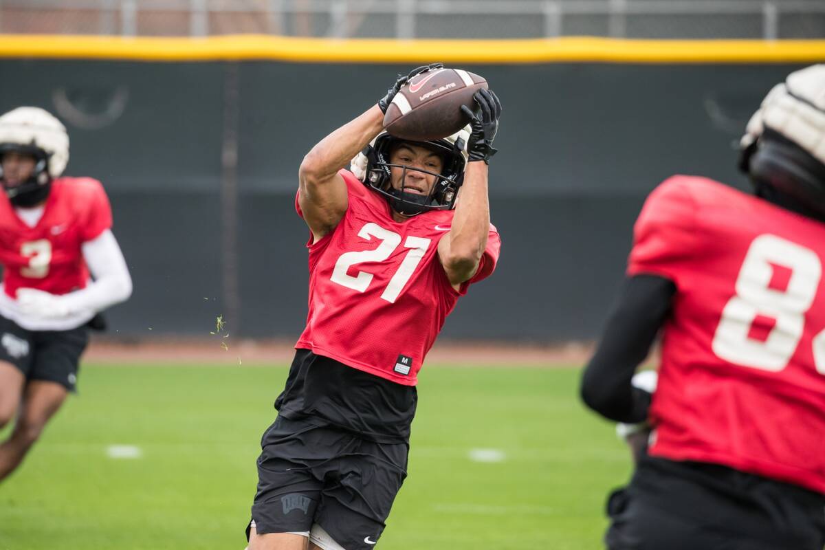 UNLV junior wide receiver Jacob De Jesus catches a pass during the Rebels' practice in preparat ...