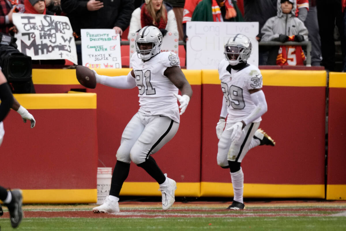 Las Vegas Raiders defensive tackle Bilal Nichols (91) celebrates after scoring on a fumble reco ...