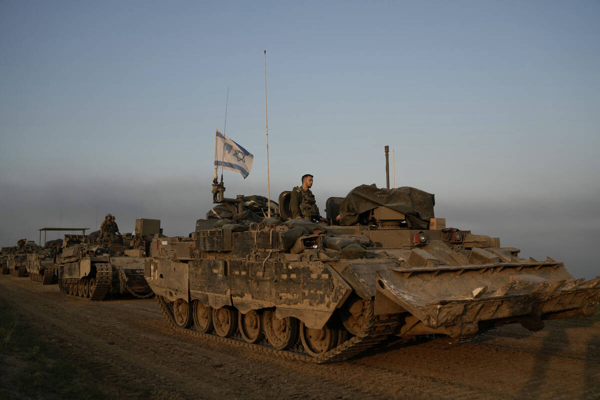 A convoy of Israeli army armoured personnel carriers (APC) is seen near the Israeli-Gaza border ...