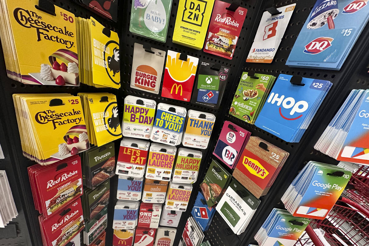 Gift cards are displayed at a Target store, in New York, Thursday, Dec. 21, 2023. Americans are ...