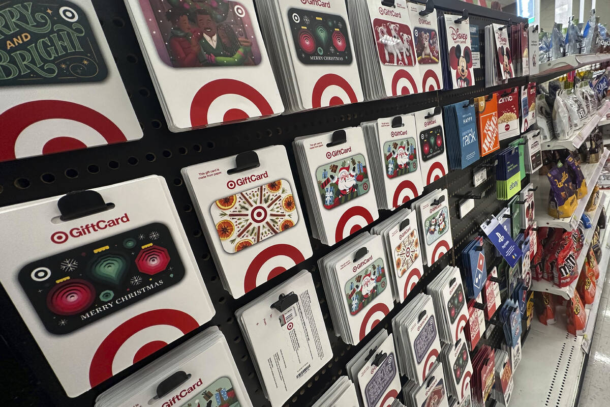 Gift cards are displayed at a Target store, in New York, Thursday, Dec. 21, 2023. Americans are ...