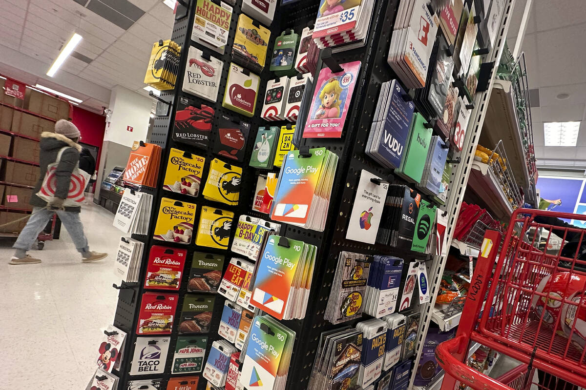 Gift cards are displayed at a Target store, in New York, Thursday, Dec. 21, 2023. Americans are ...