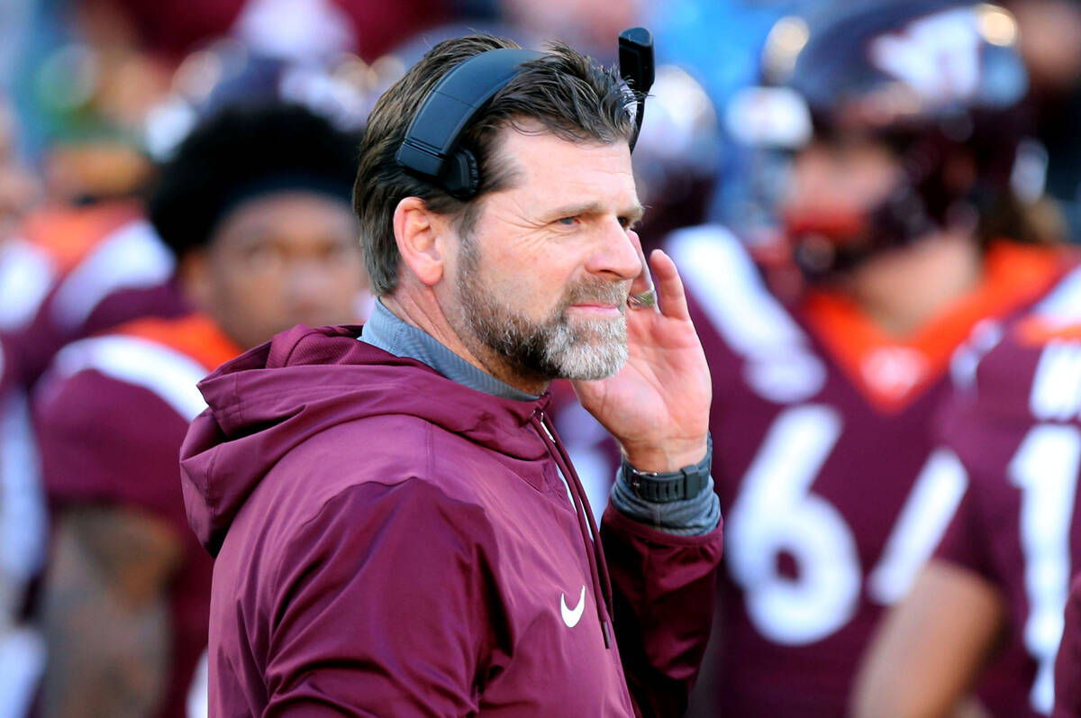 Virginia Tech head coach Brent Pry stands on the sideline prior to an NCAA college football gam ...