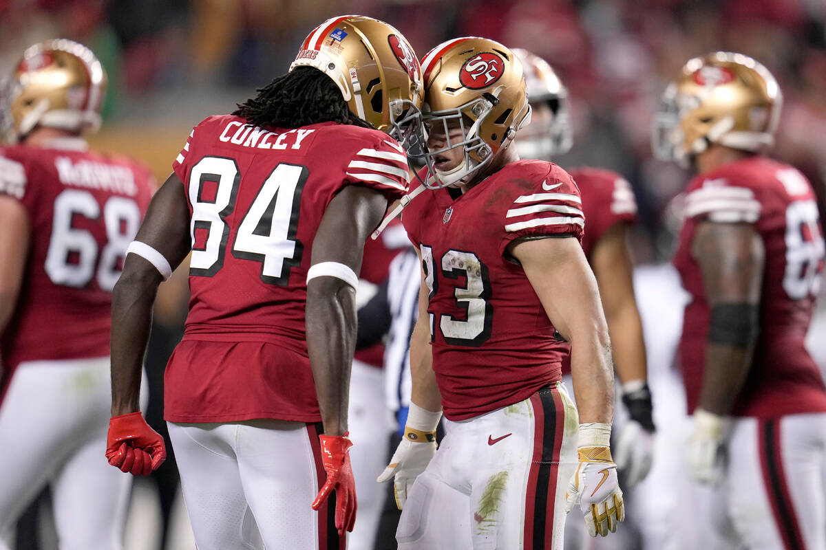 San Francisco 49ers running back Christian McCaffrey, right, is congratulated by wide receiver ...