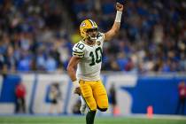 Green Bay Packers quarterback Jordan Love celebrates after throwing a touchdown pass during the ...