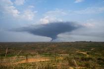 Smoke rises following an Israeli bombardment in the Gaza Strip, as seen from southern Israel, W ...