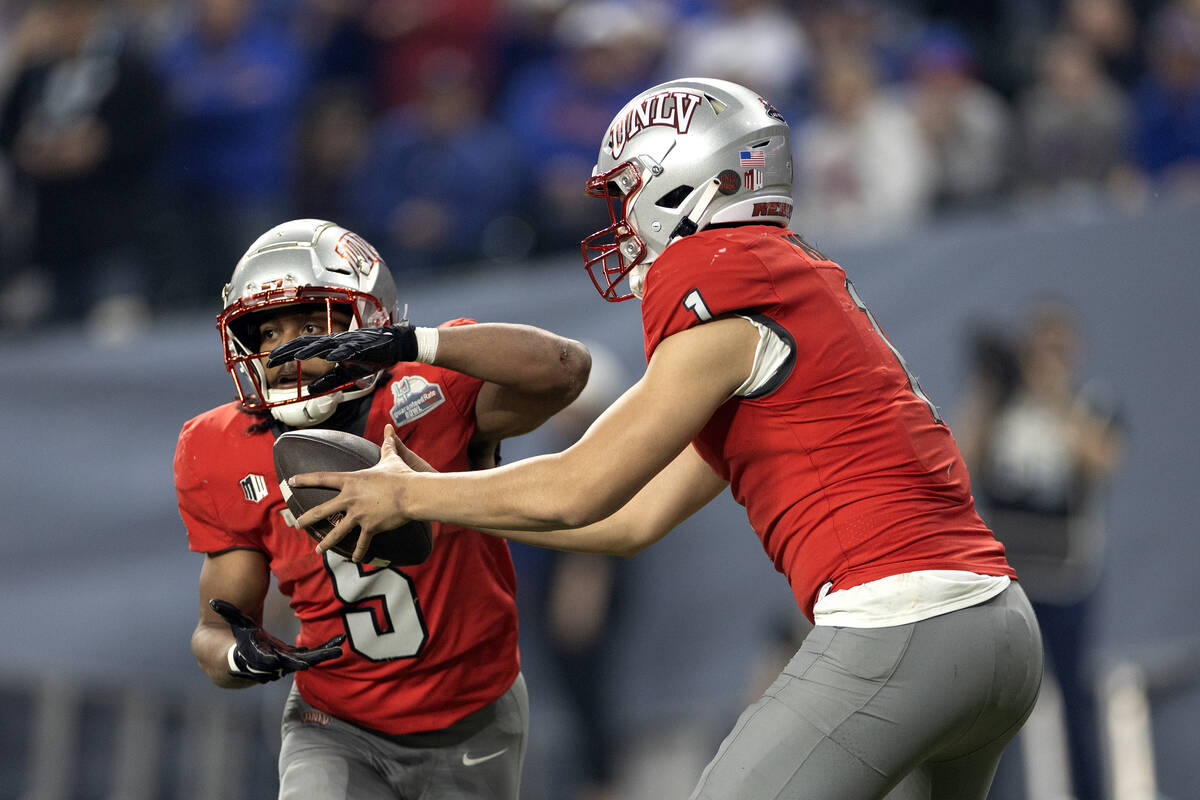 UNLV Rebels quarterback Jayden Maiava (1) hands the ball off to running back Vincent Davis Jr. ...