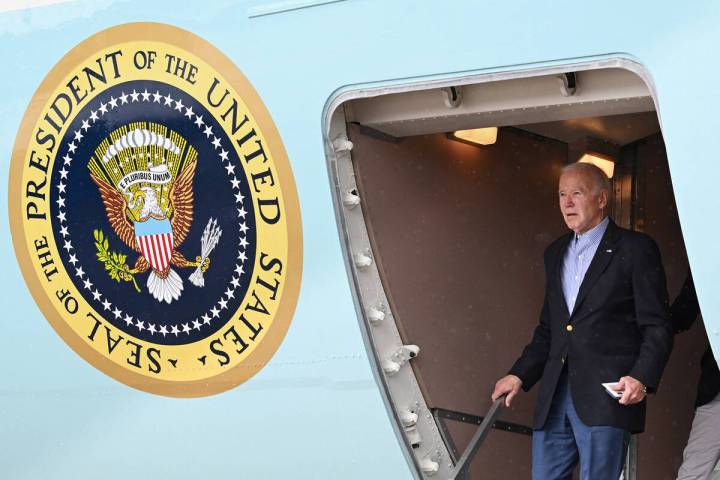 US President Joe Biden steps off Air Force One upon arrival at Henry E. Rohlsen Airport in Chri ...