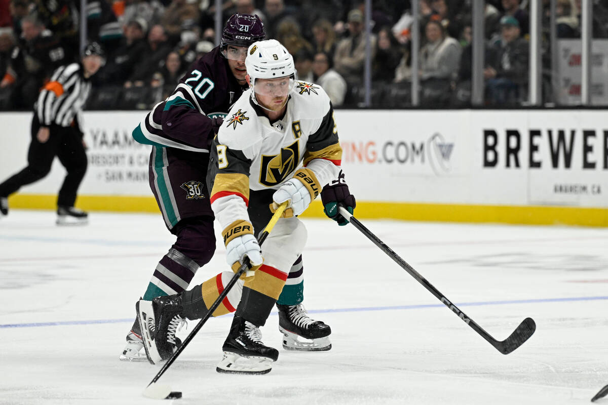 Vegas Golden Knights center Jack Eichel (9) controls the puck with pressure from Anaheim Ducks ...