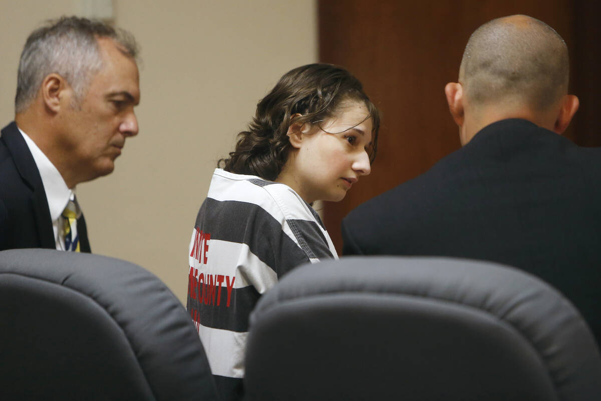 Gypsy Rose Blanchard speaks with her attorney's Mike Stanfield, right, and Clate Baker before h ...