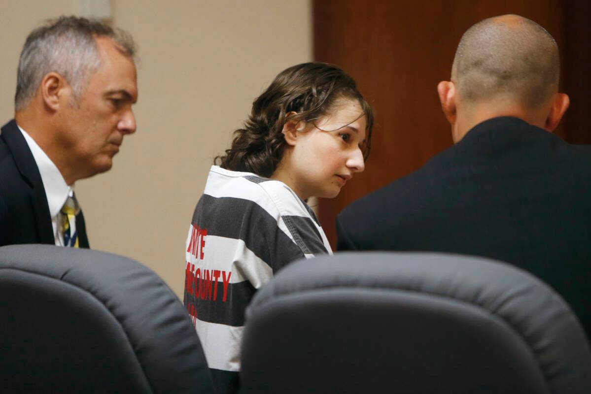 Gypsy Rose Blanchard speaks with her attorney's Mike Stanfield, right, and Clate Baker before h ...