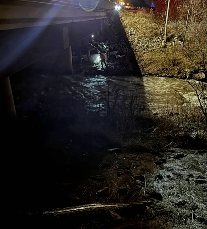 This photo provided by the Indiana State Police, police rescue a man after finding his damaged ...