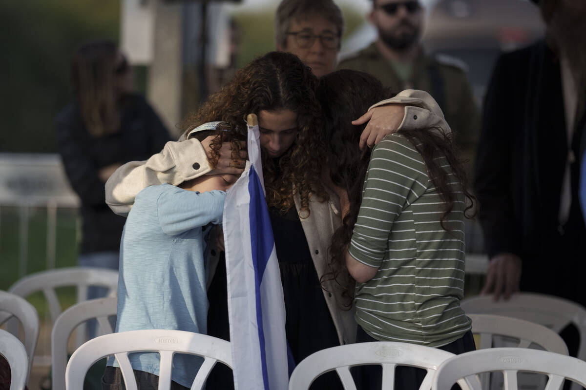 Relatives of the Israeli Captain Neriya Zisk mourn during his funeral, at a cemetery in the vil ...