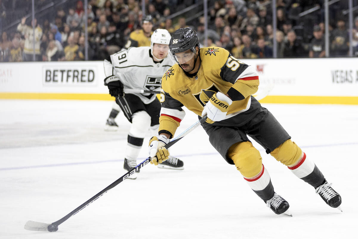 Golden Knights defenseman Keegan Kolesar (55) skates with the puck during the first period of a ...