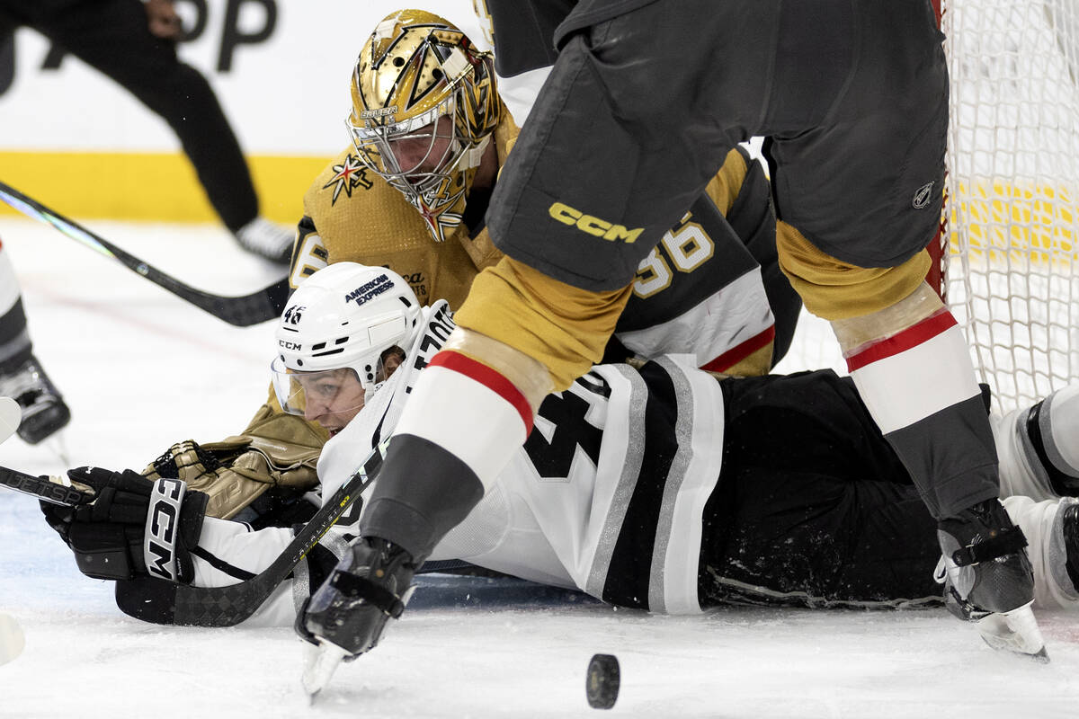 Golden Knights goaltender Logan Thompson (36) defends the net while Kings center Blake Lizotte ...