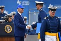 A cadet shakes hands with President Joe Biden after receiving his diploma during the United Sta ...