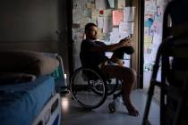 Israeli soldier Jonathan Ben Hamou, 22, wounded in the war with Hamas, sits in his room at Sheb ...