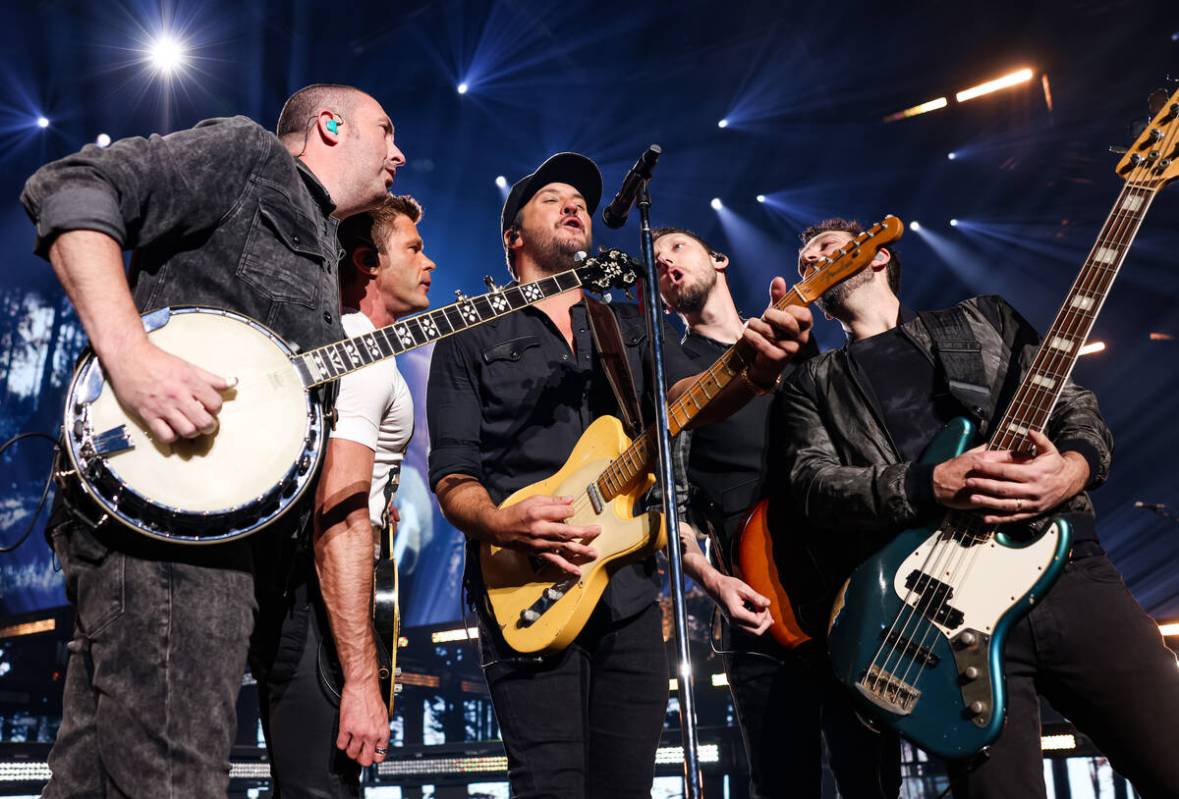 Luke Bryan (C) performs during the opening night of his residency at Resorts World Las Vegas on ...