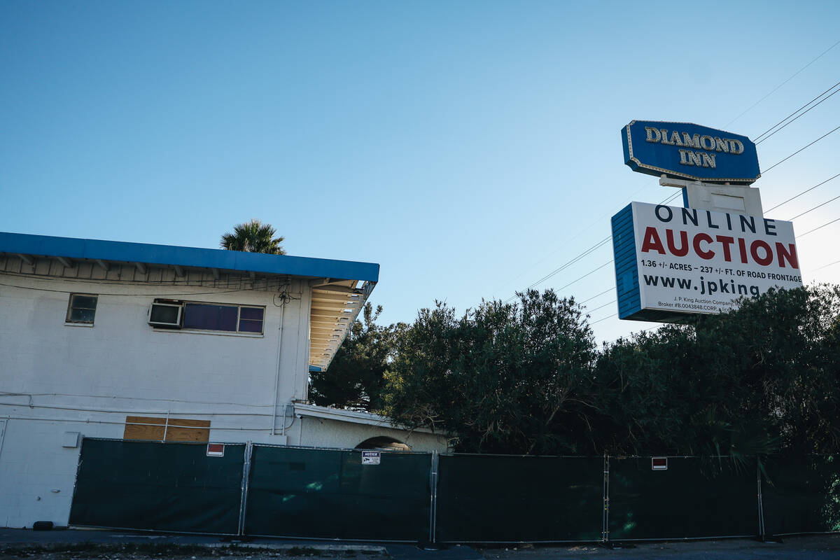 The sign for the Diamond Inn Motel is seen with an auction sign beneath it at the Diamond Inn M ...