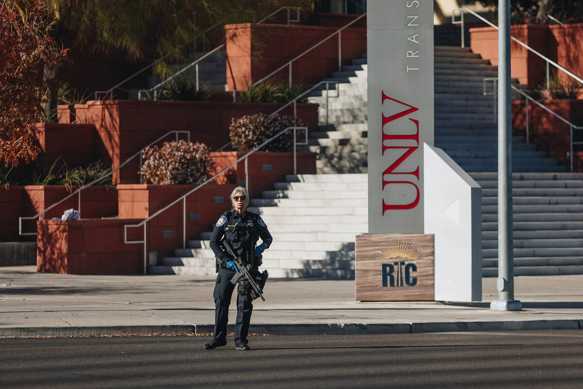 Police are seen at the scene of a shooting on the UNLV campus on Wednesday, Dec. 6, 2023, in La ...