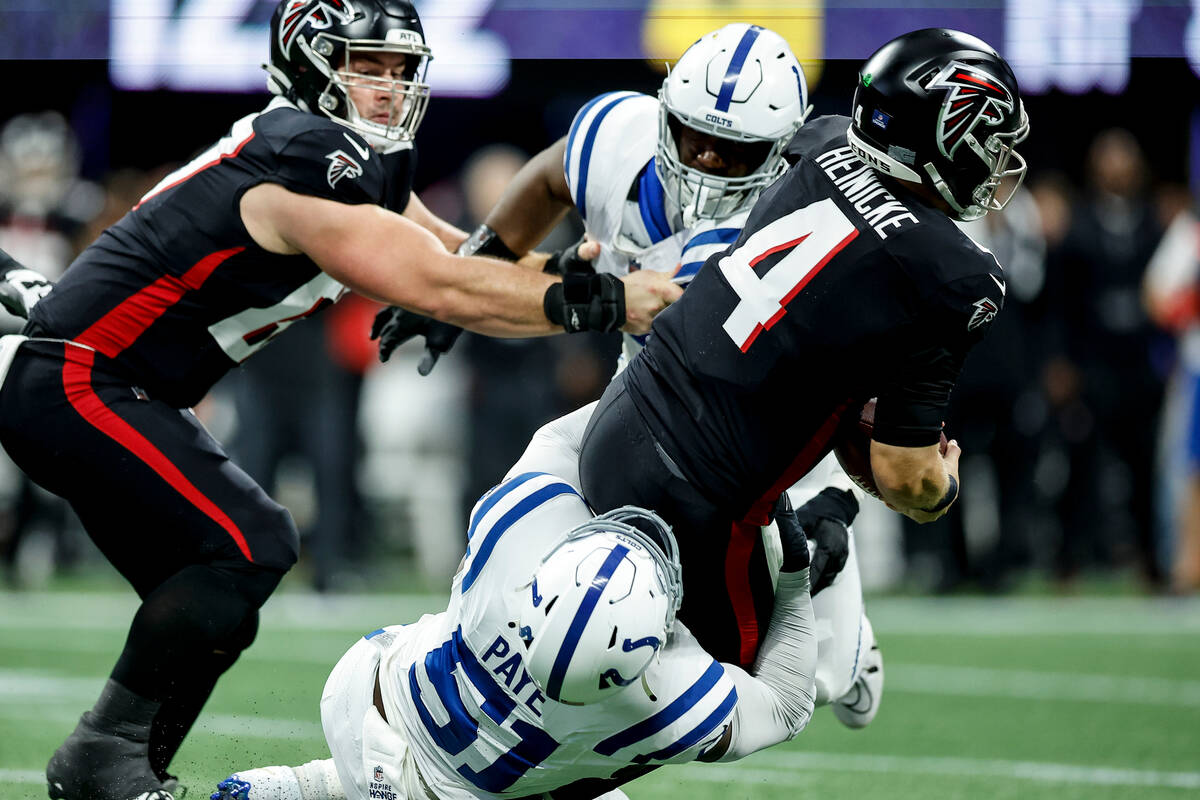 Indianapolis Colts defensive end Kwity Paye (51) tackles Atlanta Falcons quarterback Taylor Hei ...