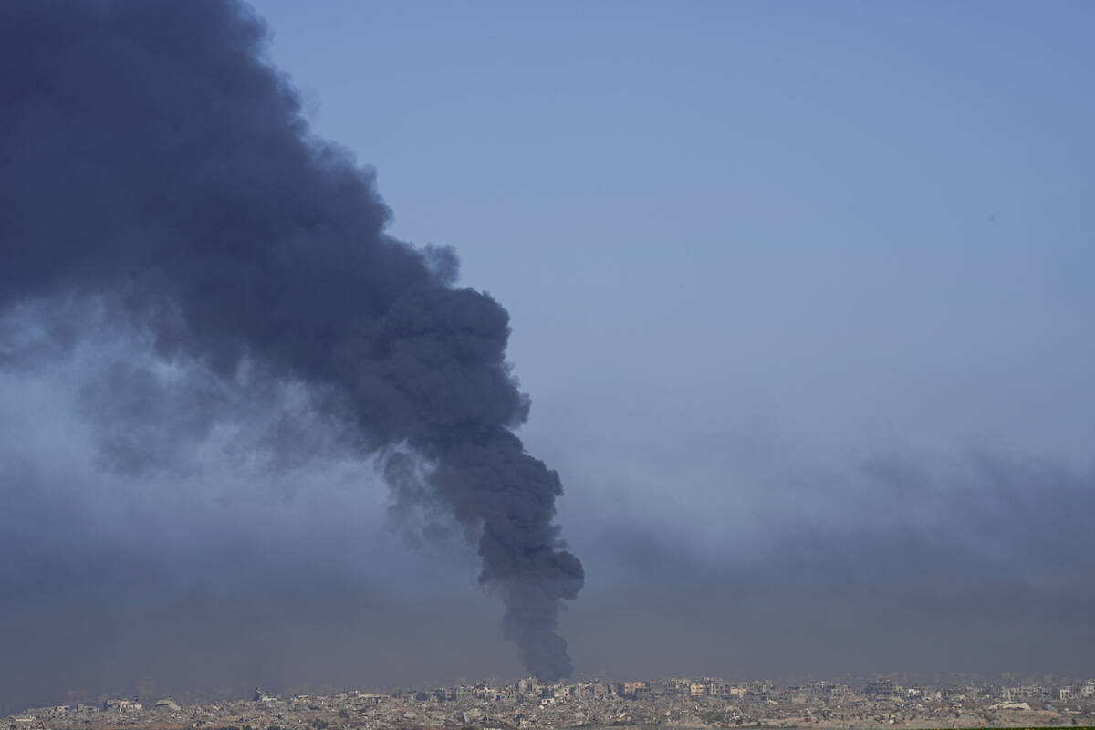 Smoke rises following an Israeli airstrike in the Gaza Strip, as seen from southern Israel, Fri ...