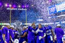 The Washington Huskies celebrate their Pac-12 Football Championship game win against the Oregon ...