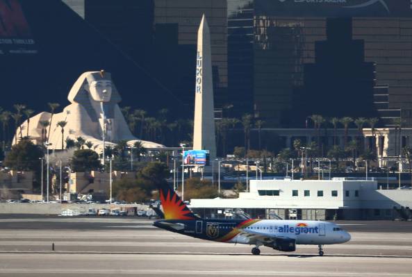 An Allegiant Air airplane taxis to a Terminal 1 gate at Harry Reid International Airport in Las ...