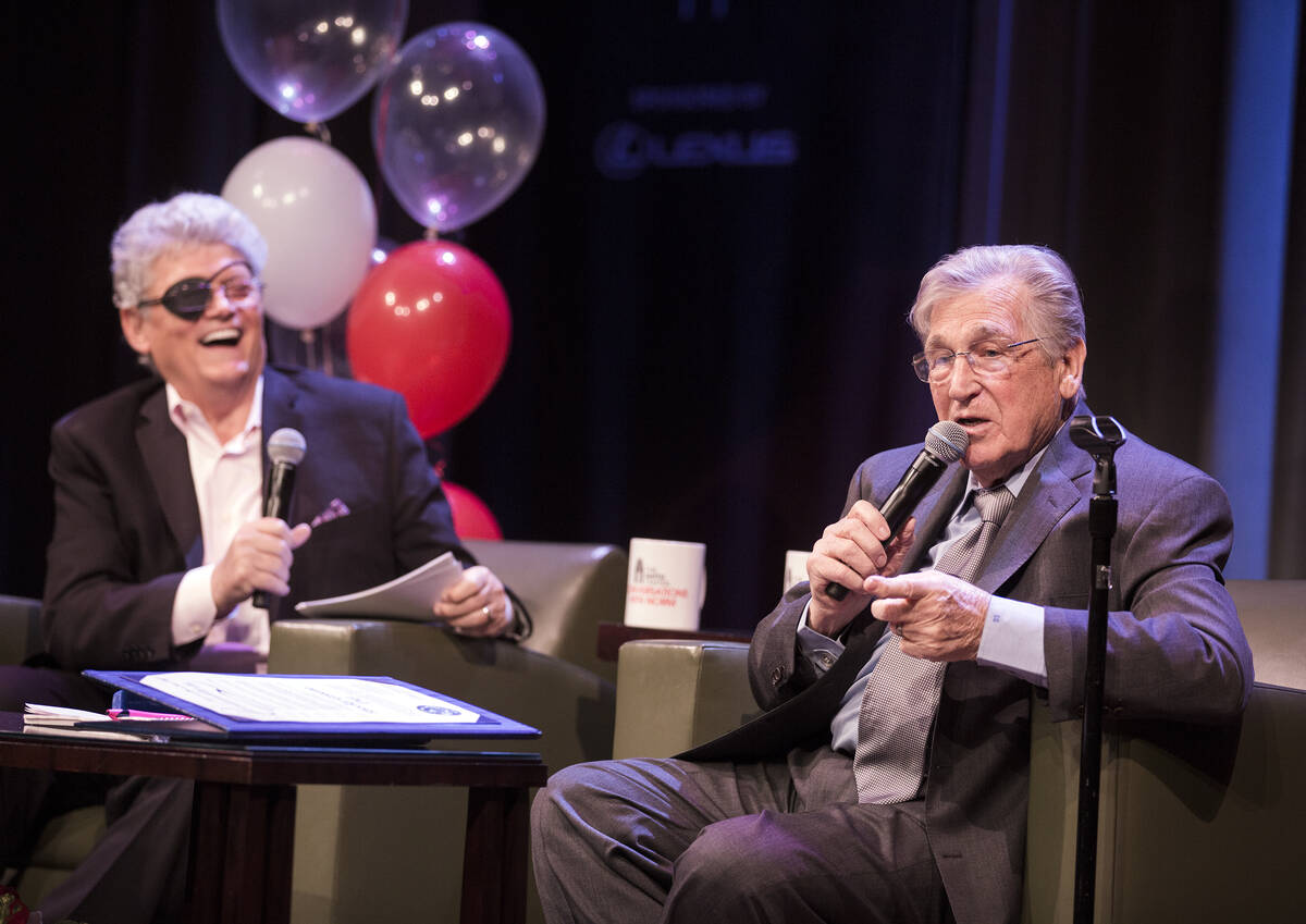 Review-Journal columnist Norm Clarke laughs while comedian Shecky Greene tells a story during C ...