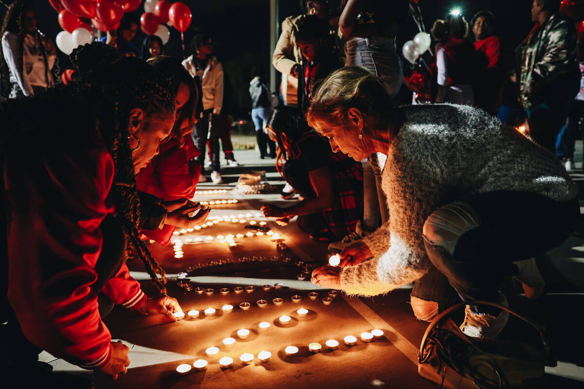 Candles are lit during a vigil in honor of Keon Young at Desert Horizons Park on Friday, Dec. 2 ...