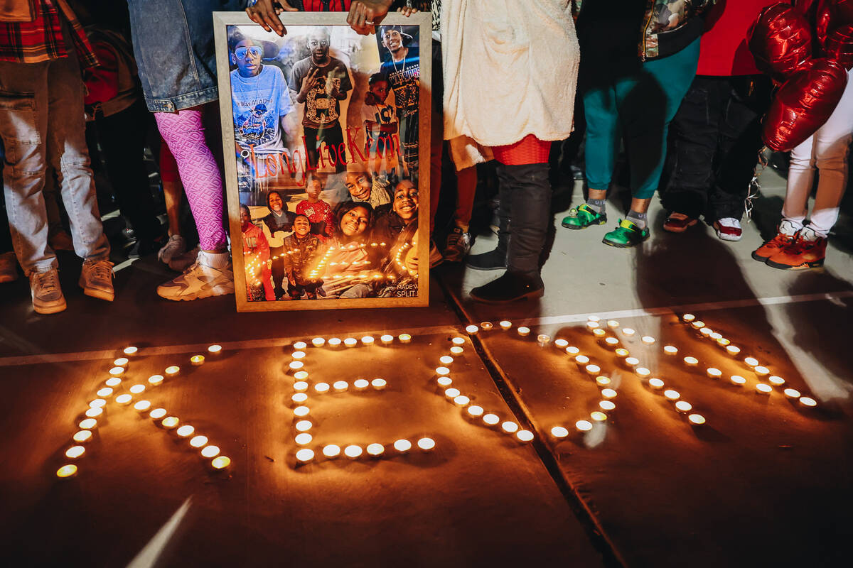 Candles spell out the name of Keon Young during a vigil in his honor at Desert Horizons Park on ...