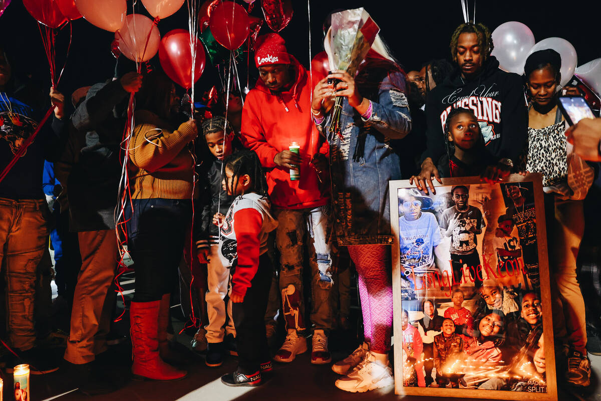 The family of Keon Young gather during a vigil in his honor at Desert Horizons Park on Friday, ...