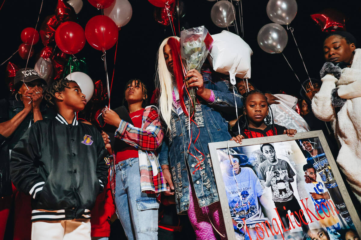 Keonta Cook, middle, the mother of Keon Young, takes a moment before continuing to speak about ...