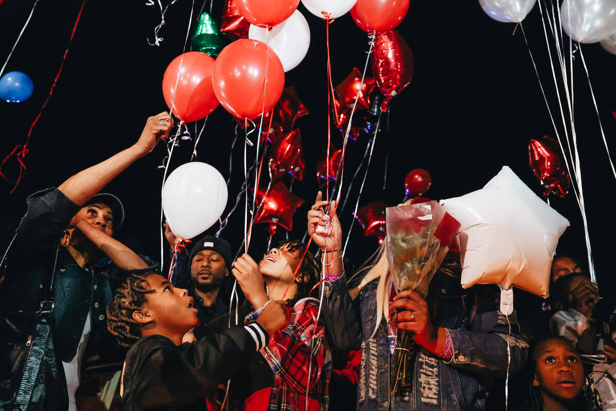 Friends and family release balloons during a vigil for Keon Young at Desert Horizons Park on Fr ...