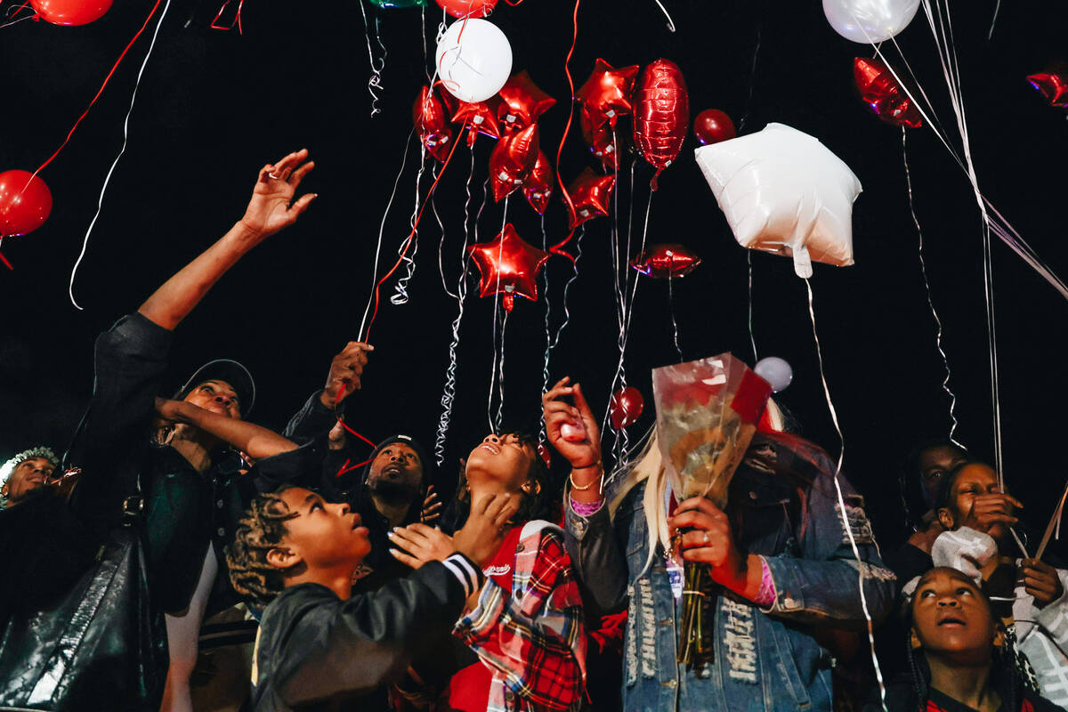 Friends and family release balloons during a vigil for Keon Young at Desert Horizons Park on Fr ...