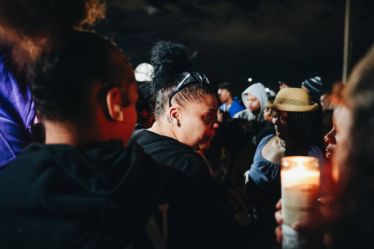 A mourner cries during a vigil for Keon Young at Desert Horizons Park on Friday, Dec. 29, 2023, ...