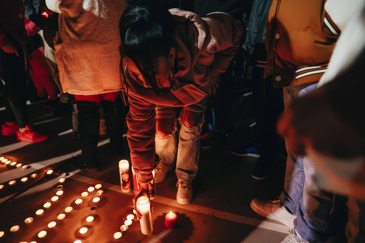 Candles are placed at a vigil for Keon Young at Desert Horizons Park on Friday, Dec. 29, 2023, ...