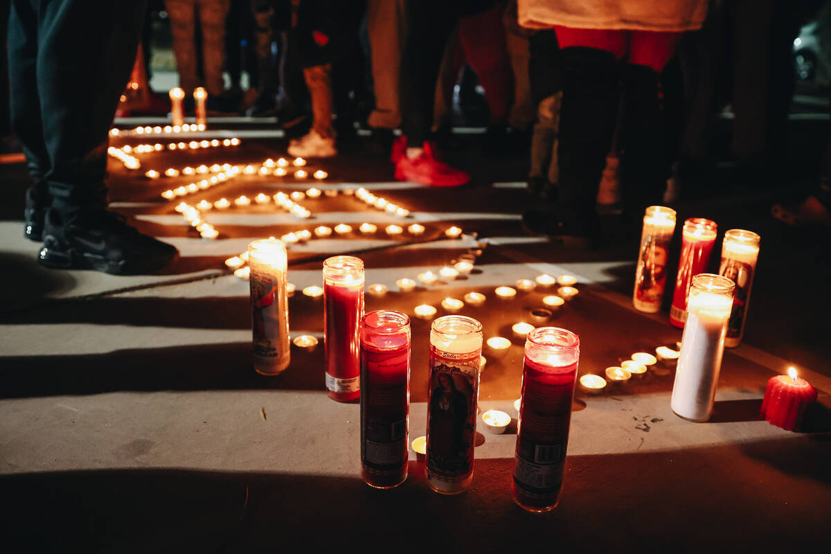 Candles are seen at a vigil for Keon Young at Desert Horizons Park on Friday, Dec. 29, 2023, in ...