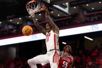 UNLV Rebels forward Kalib Boone (10) dunks on Loyola Marymount Lions guard Dominick Harris (55) ...